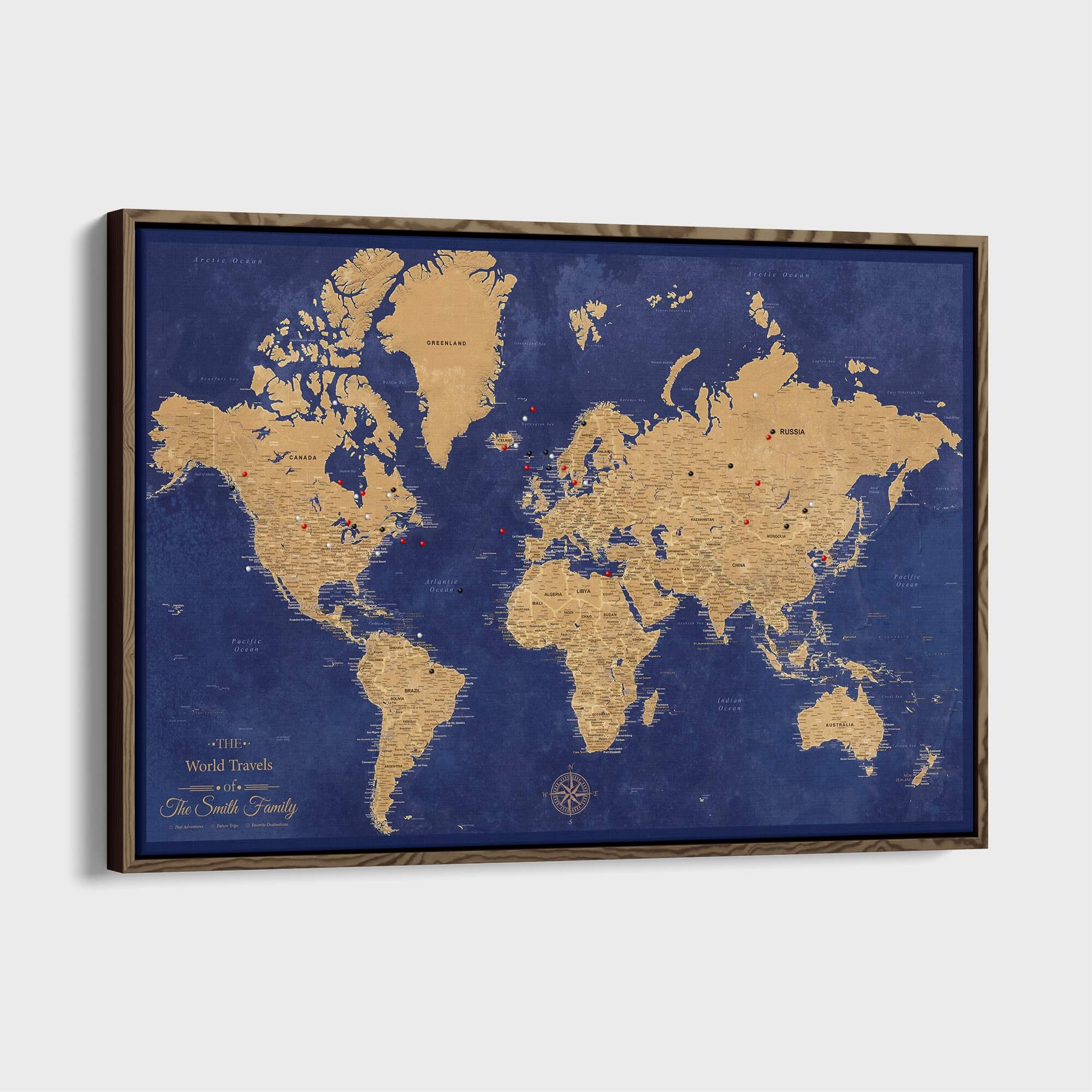 Personalized gold and navy world travel push pin map on framed canvas with colorful pins marking destinations