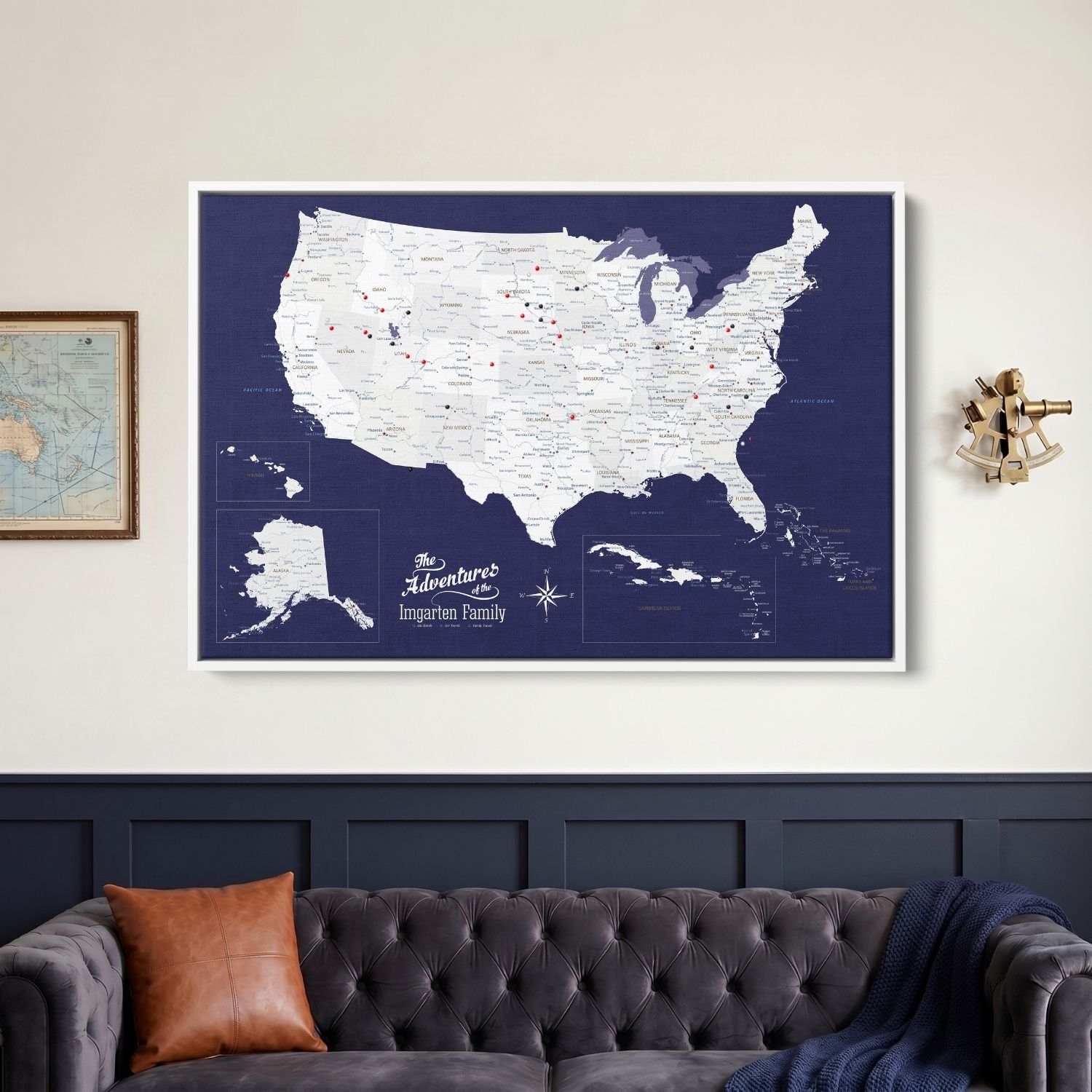 Personalized navy canvas USA Caribbean travel map with red pins hung above tufted sofa