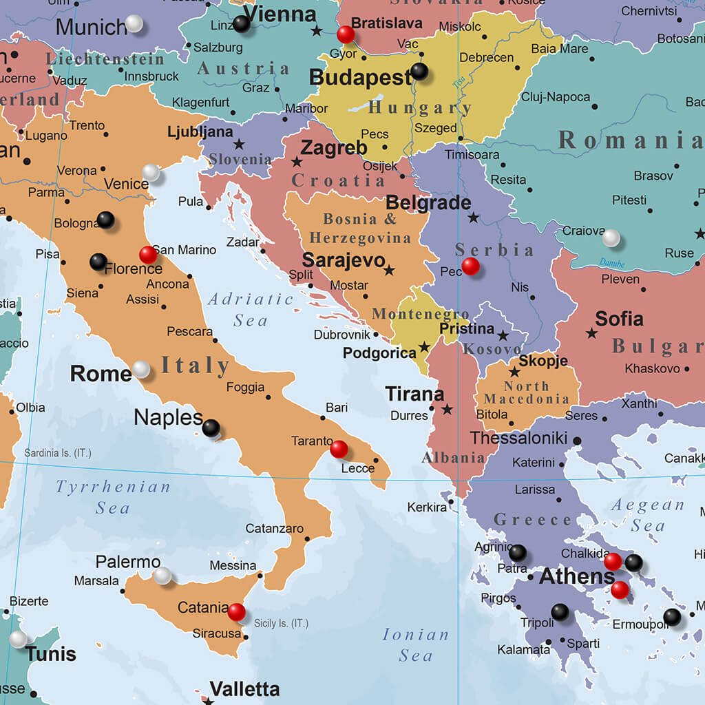 Colorful framed canvas Europe travel map with push pins marking cities across Italy Greece and the Balkans