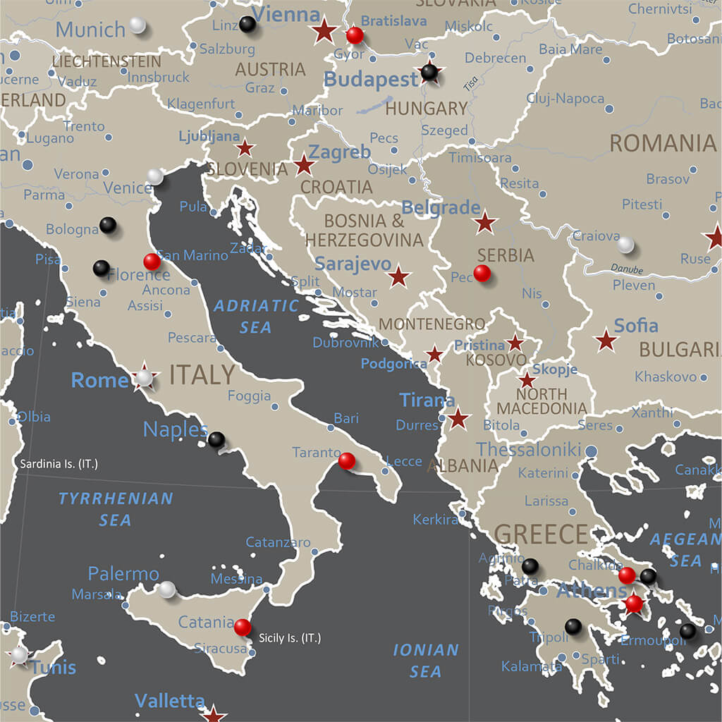 Earth toned Europe travel map close-up showing Italy Greece Balkans with colorful pins marking visited cities