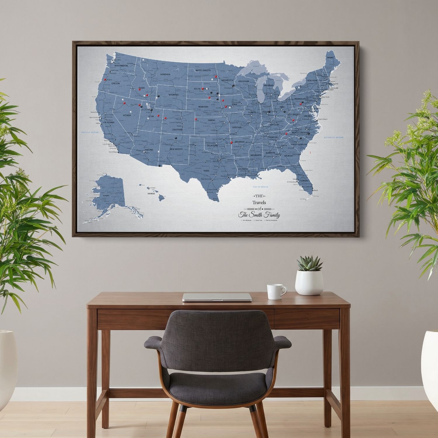 Personalized blue ice USA push pin travel map canvas hung above modern wood desk in home office