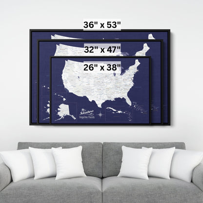 Three size options of navy blue USA Caribbean canvas travel map displayed above gray sofa