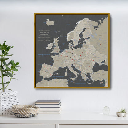 Earth toned Europe travel map canvas with red pins in gold float frame on white wall
