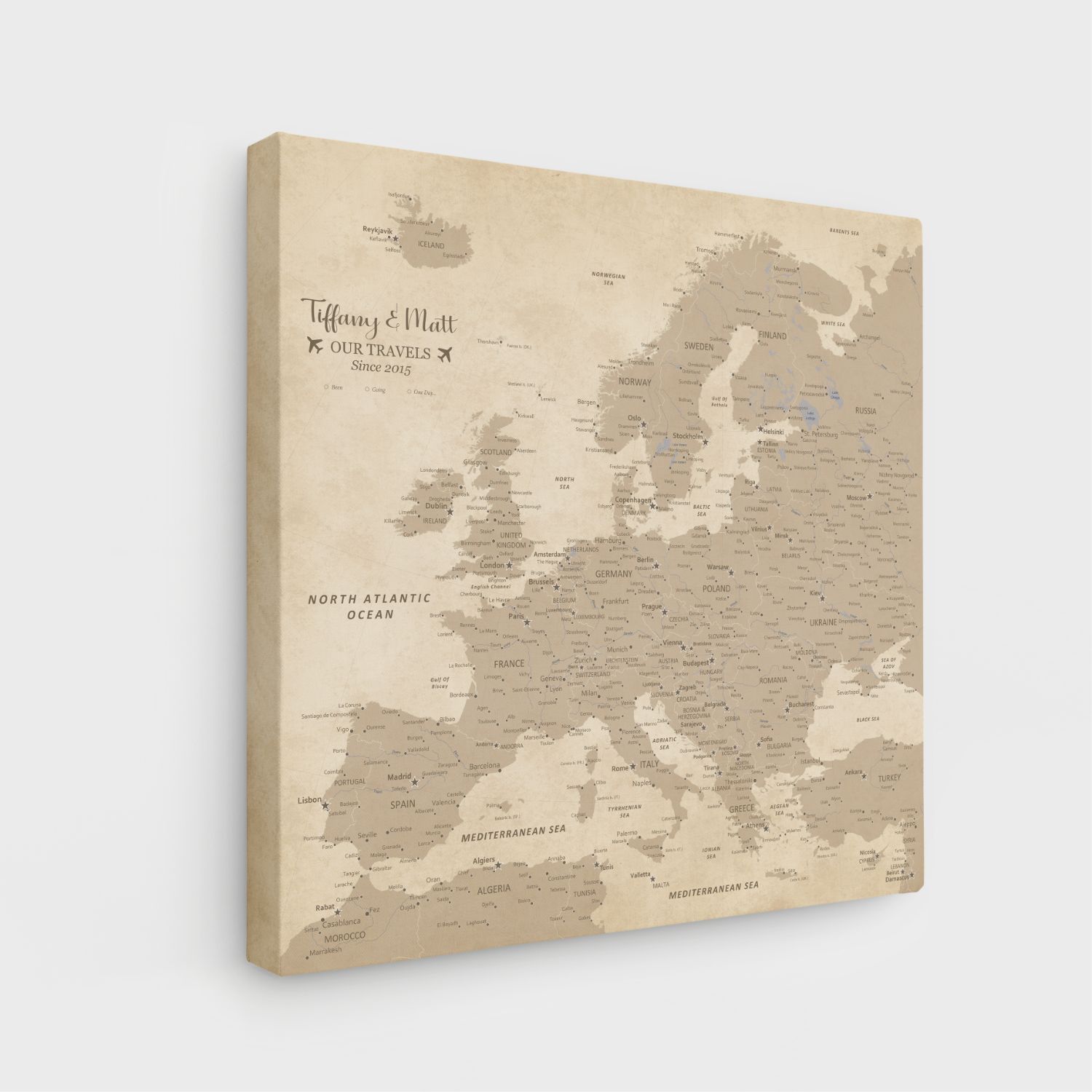 Angled view of gallery wrapped vintage Europe travel map canvas with personalized couples names text