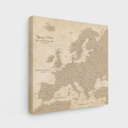 Angled view of gallery wrapped vintage Europe travel map canvas with personalized couples names text