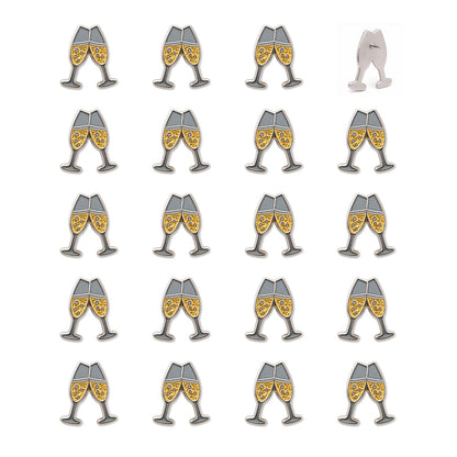 Grid of 20 champagne toast enamel push pins with gold glitter flutes and silver nickel outlines, one showing back pin mechanism